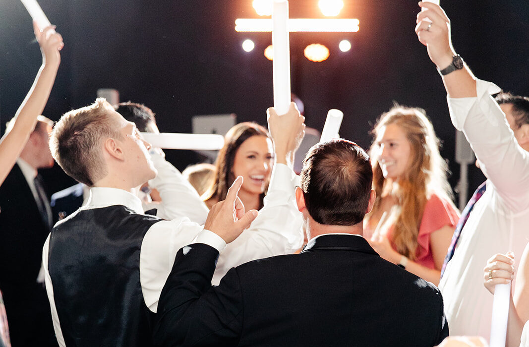 Wedding Guests Dancing under Dance Floor Lighting